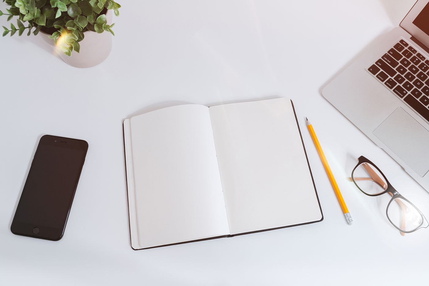 Notebook and laptop on a desk